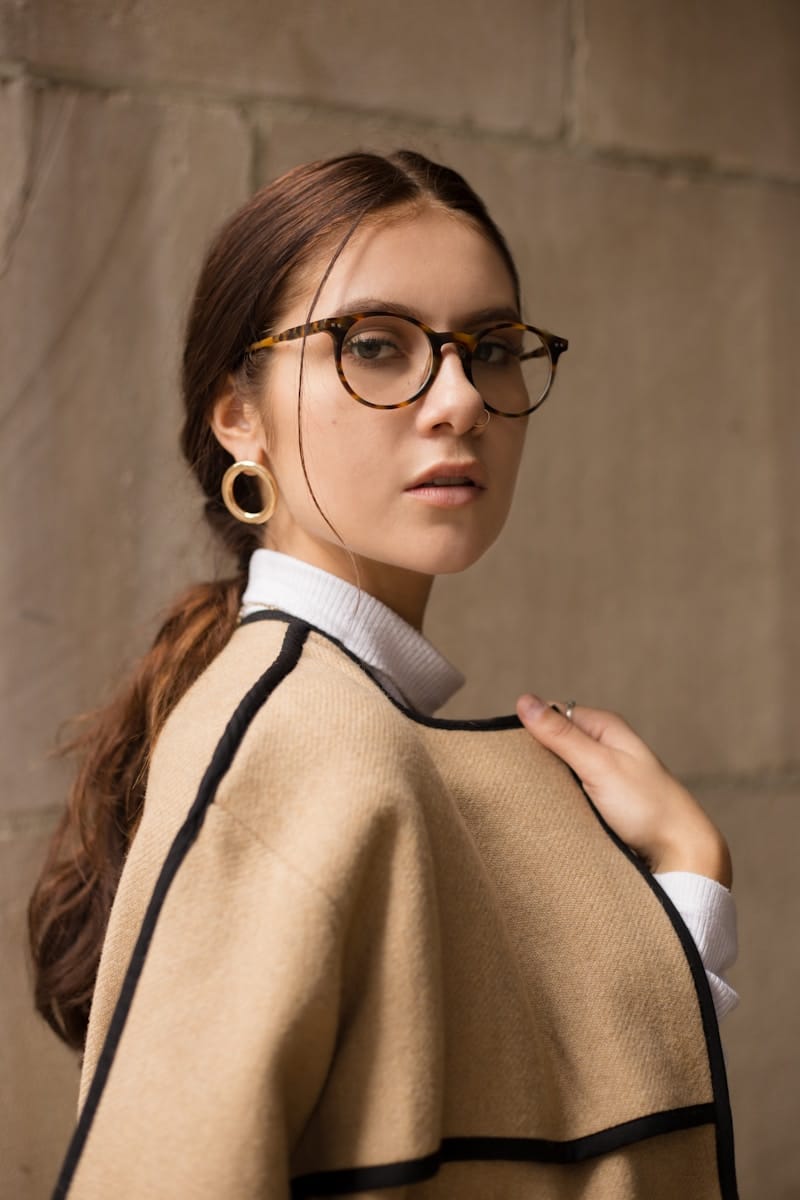 Photo by Carlos Vaz woman wearing brown and black coat